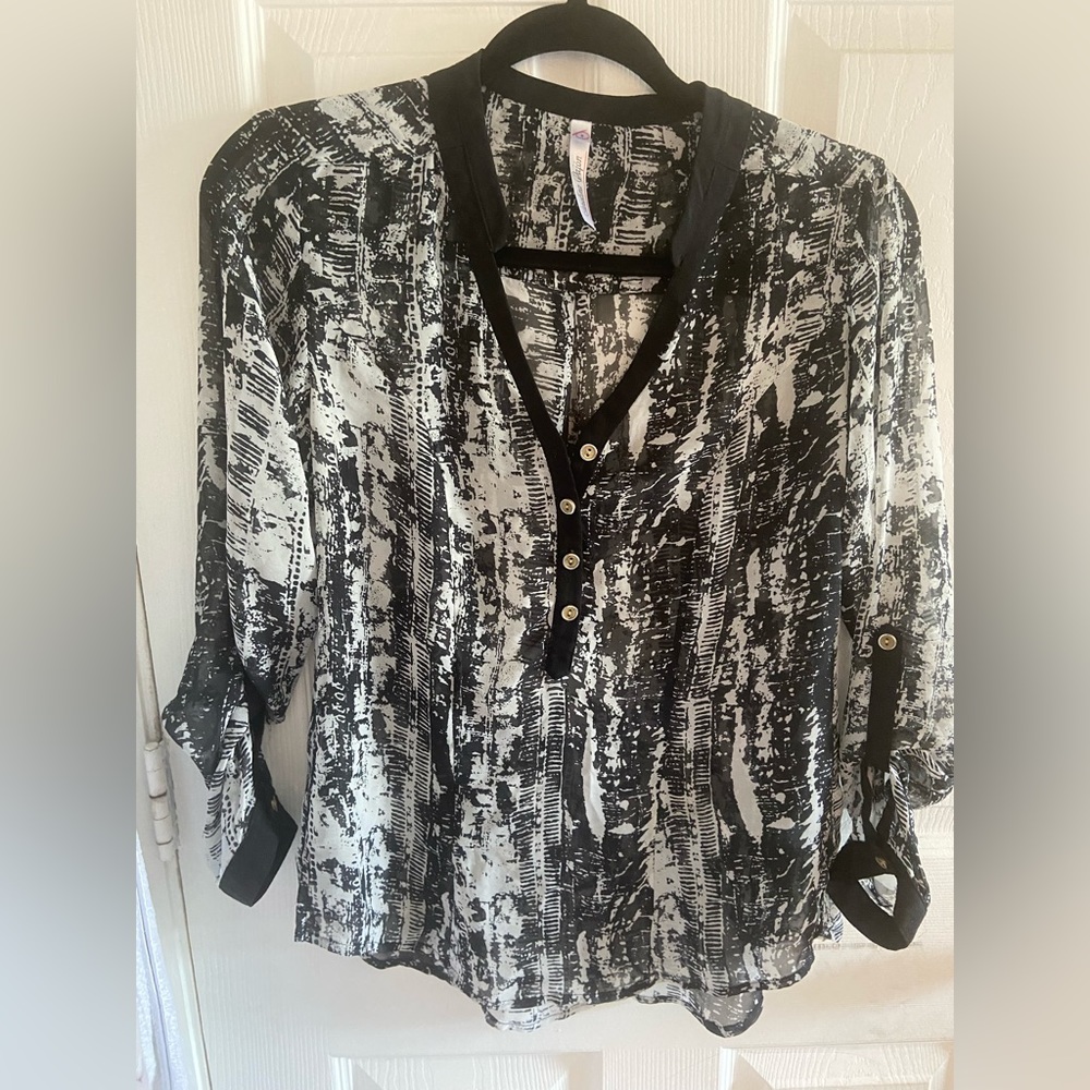 Transparent pull over top perfect for the office priced low for quick sale.